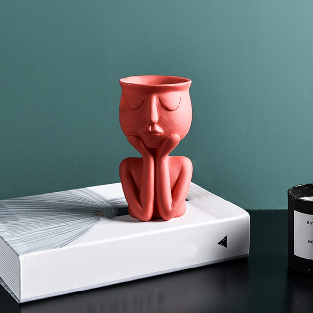 Red figurine vase